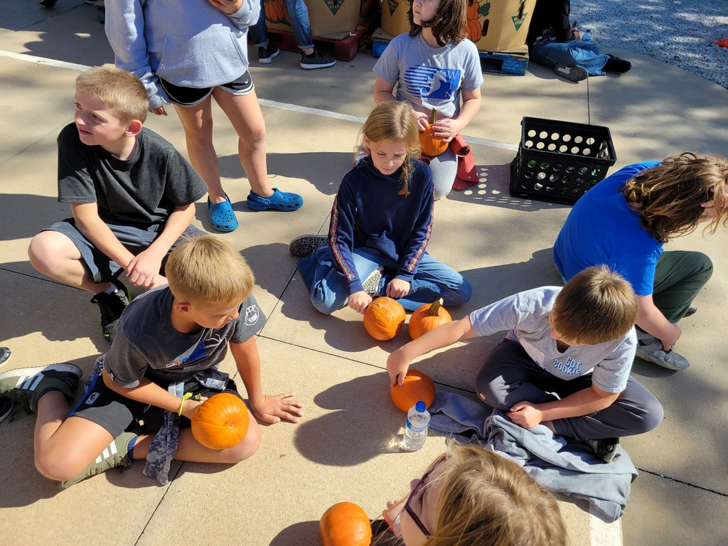 students with pumpkins